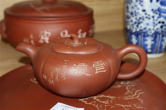 A Yixing pottery covered bowl and stand and a similar teapot